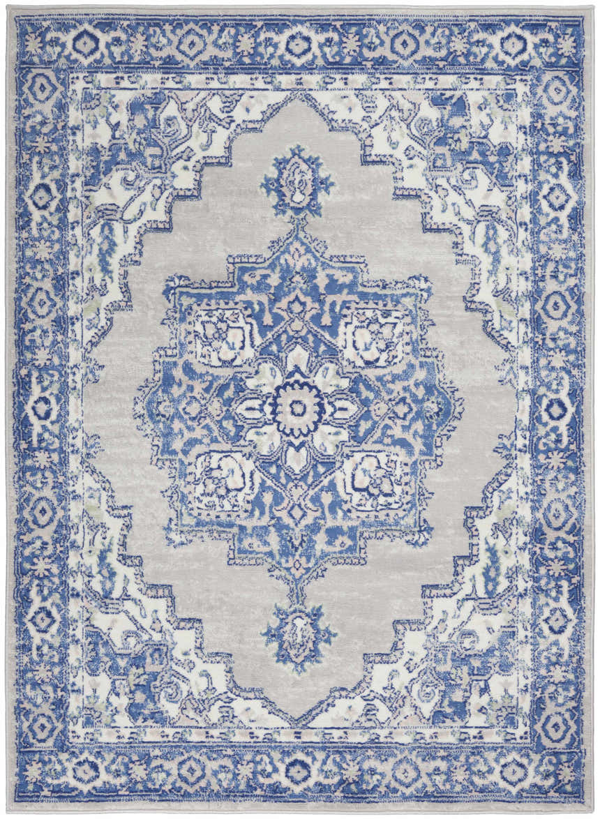 Close-up of the Nourison Whimsicle Grey Blue Farmhouse rug featuring a detailed blue and gray traditional floral pattern.