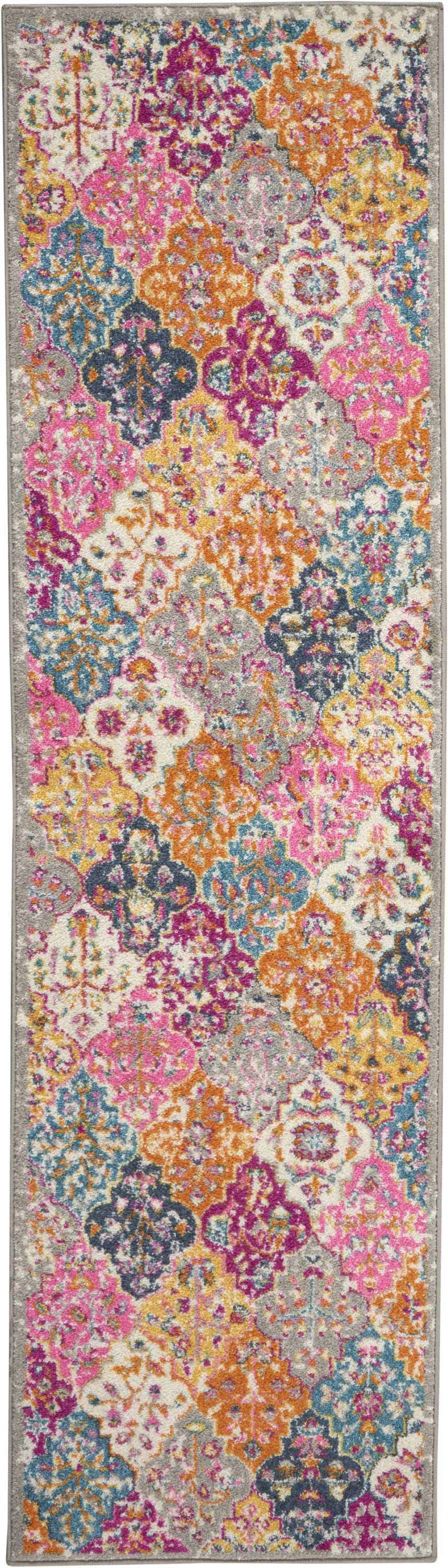 Close-up of Nourison Passion Multicolor Bohemian rug featuring floral, geometric pattern in pink, orange, blue, and yellow.