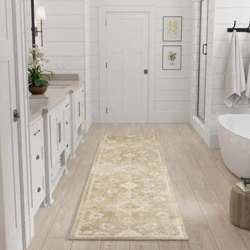 Bathroom scene with white cabinets and Nourison Astra Ivory Gold Vintage Area Rug runner.
