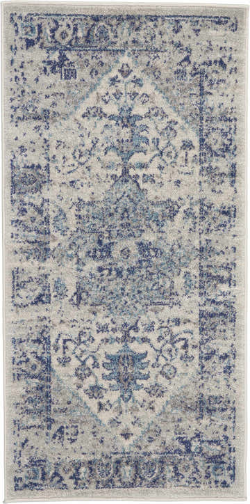 Close-up of Nourison Tranquil Ivory Light Blue Vintage Area Rug, featuring a distressed floral pattern.