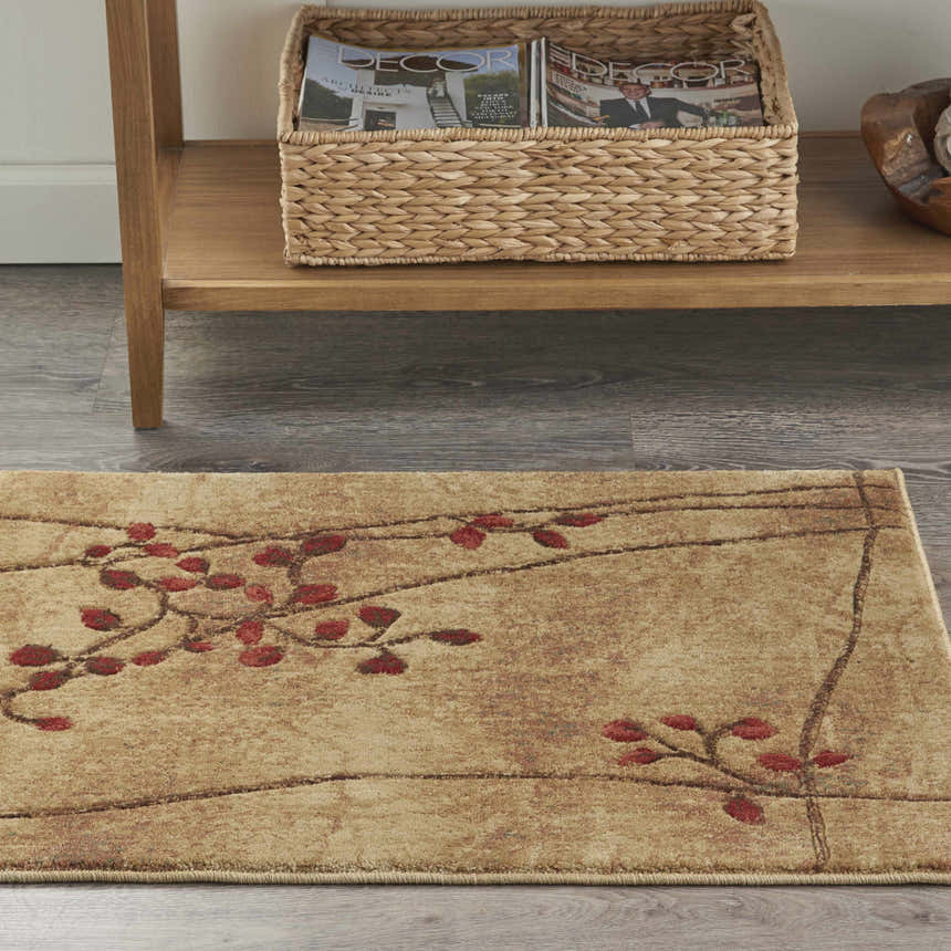 Close-up of the Nourison Somerset Latte Rustic Indoor Area Rug with a red floral design on a latte-colored background.