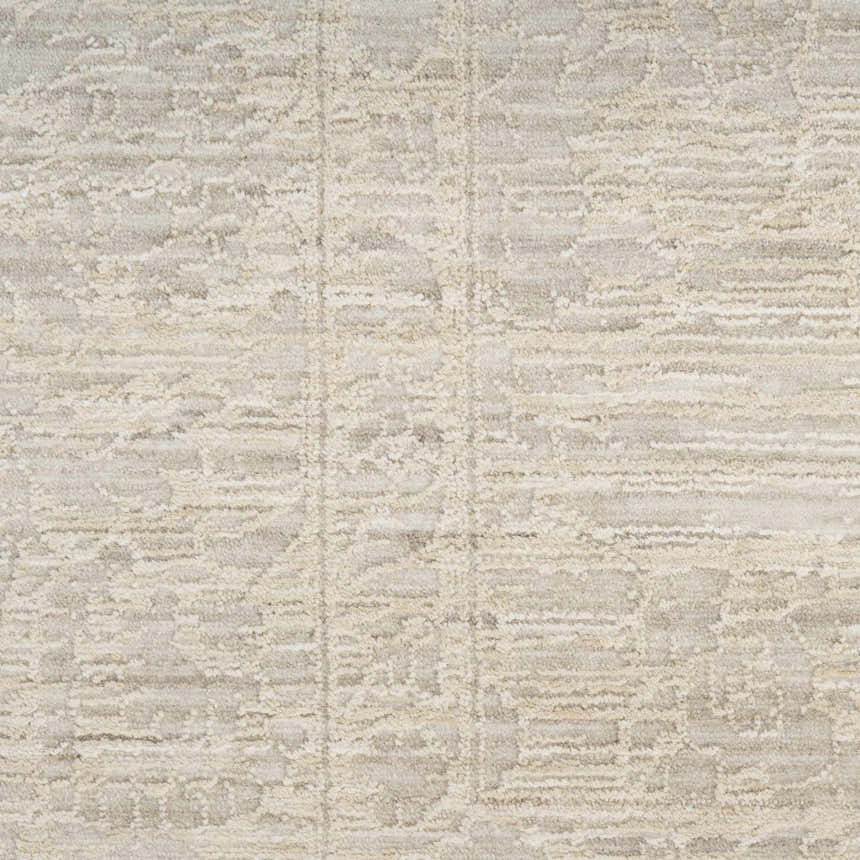 Close-up of the Nourison Shadows Ivory Grey vintage rug, showing its subtle pattern and soft pile texture.
