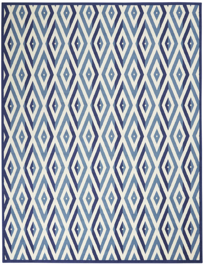 Close-up of the Nourison Grafix rug in white and blue. Features a geometric diamond pattern and mid-century modern design.