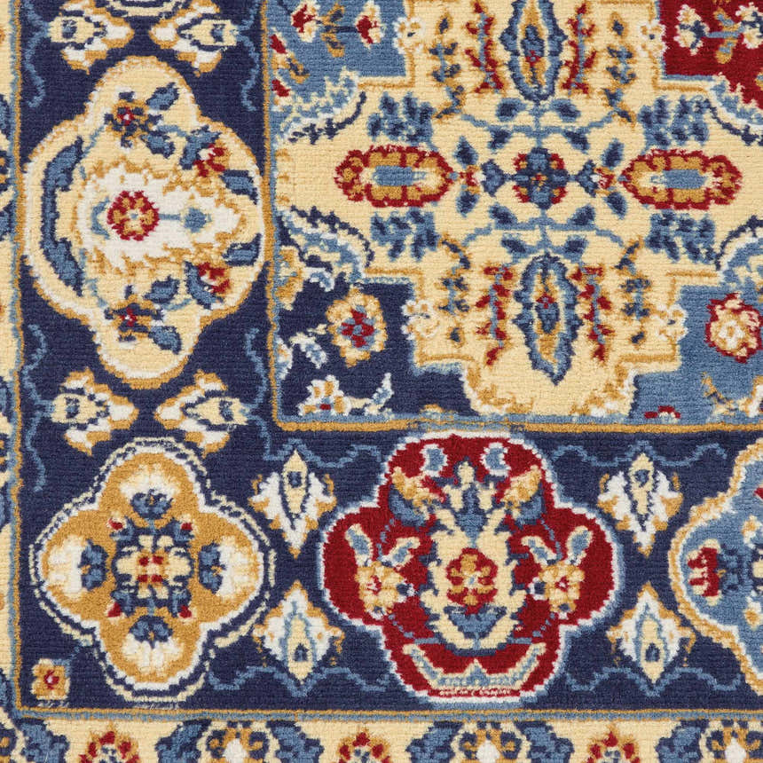 Close-up of the Nourison Grafix Multicolor Bohemian Area Rug. Features a detailed floral pattern in red, blue, and beige.