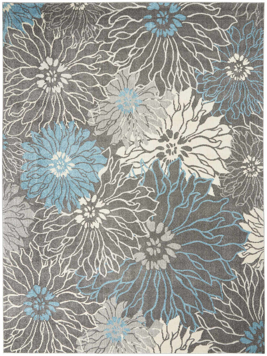Close-up of Nourison Passion Charcoal Blue rug. Contemporary floral design in taupe, gray, and blue hues.
