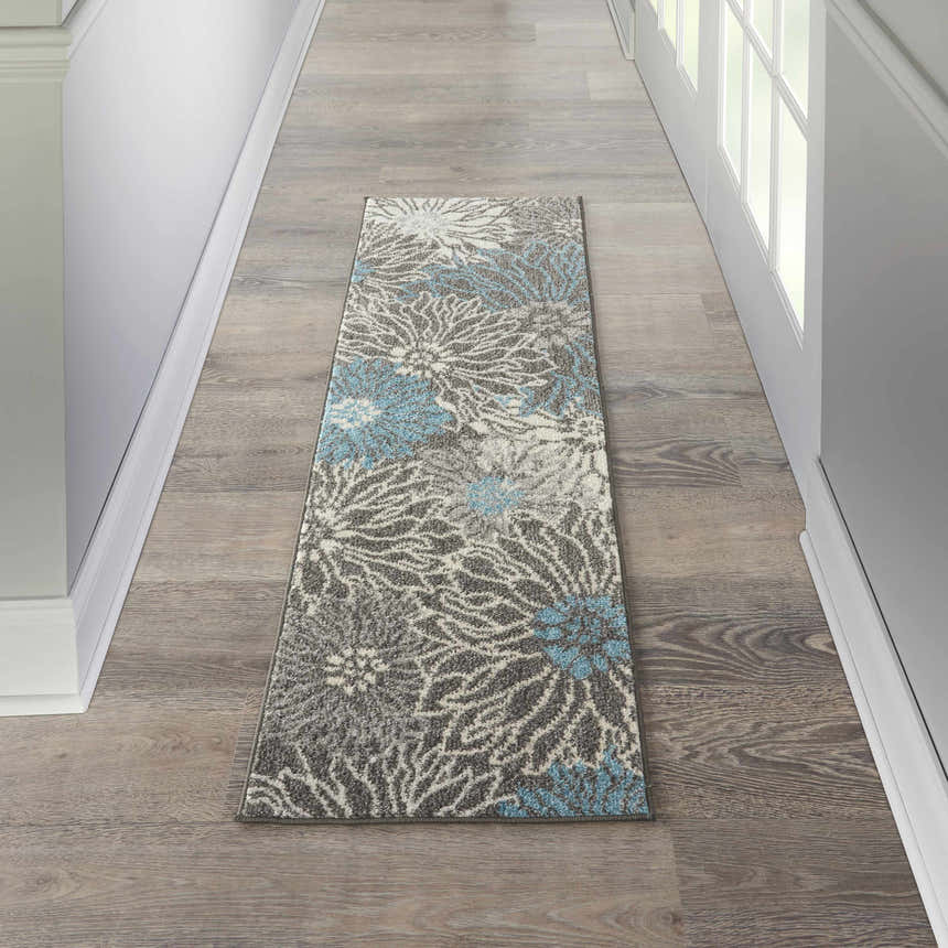 Hallway scene with Nourison Passion Charcoal Blue rug runner, floral pattern, on wood floor.
