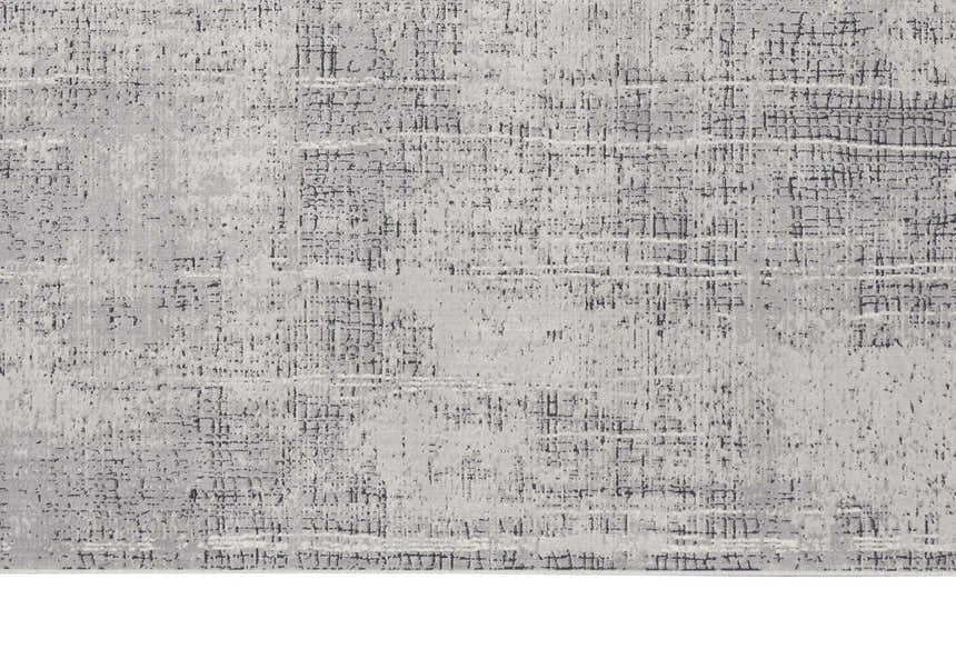 Close-up of the Calvin Klein CK970 Vapor Grey Ivory rug, showing the abstract, textured design and soft viscose material.
