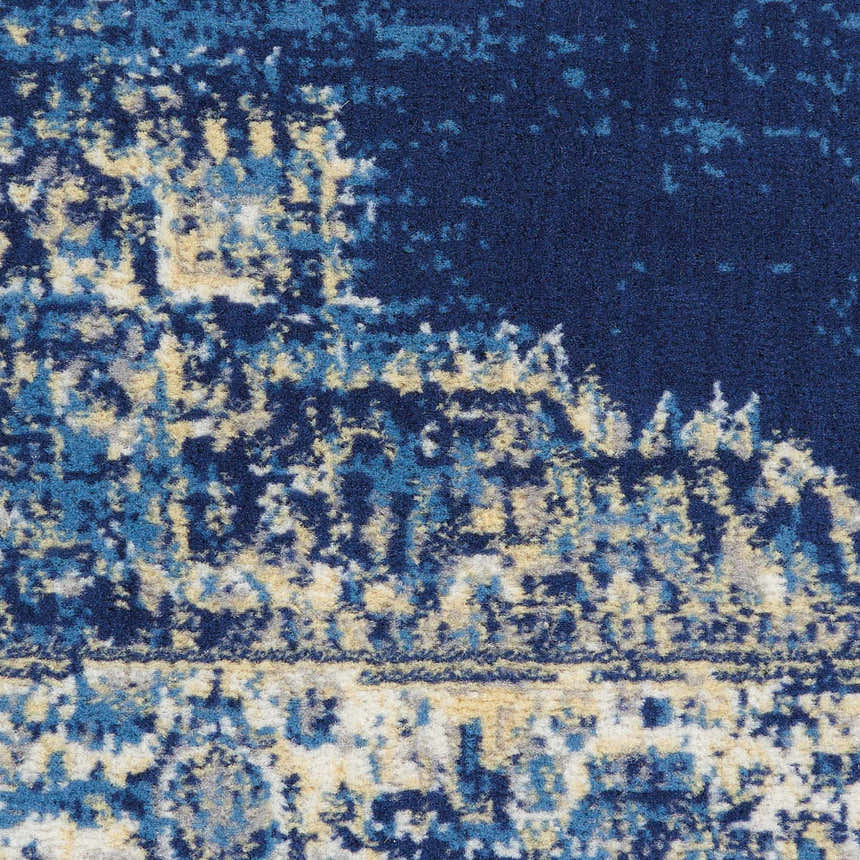 Close-up of the Nourison Grafix Navy Blue Vintage Area Rug showing its texture and distressed pattern.