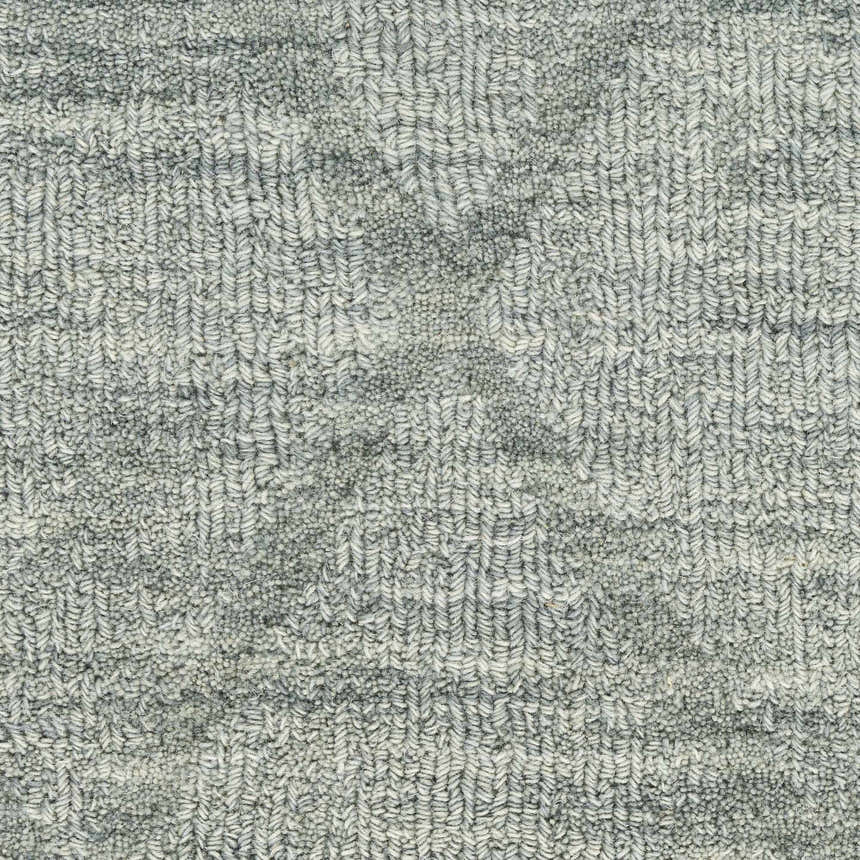 Close-up of the light blue Nourison Wool Haven rug, showing its textured, handmade pile.