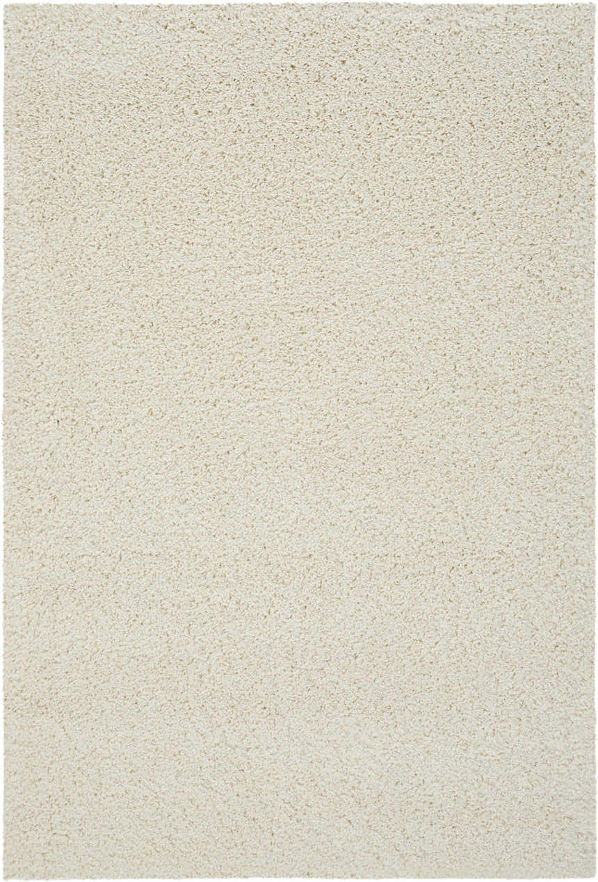 Close-up of the plush texture of the Nourison Malibu Shag Ivory area rug. Soft, shag pile in a solid, neutral ivory color.