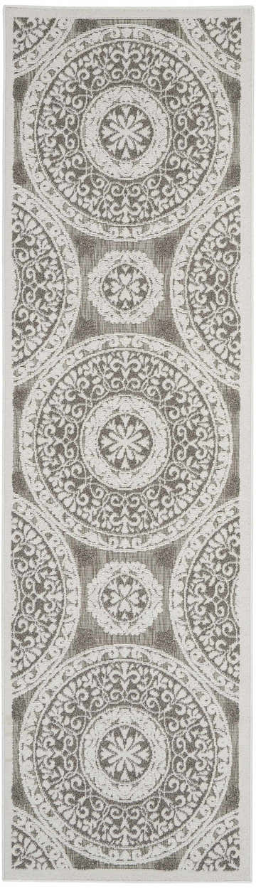 Close-up of the Nourison Key Largo Taupe runner rug featuring a contemporary medallion pattern in ivory and taupe.