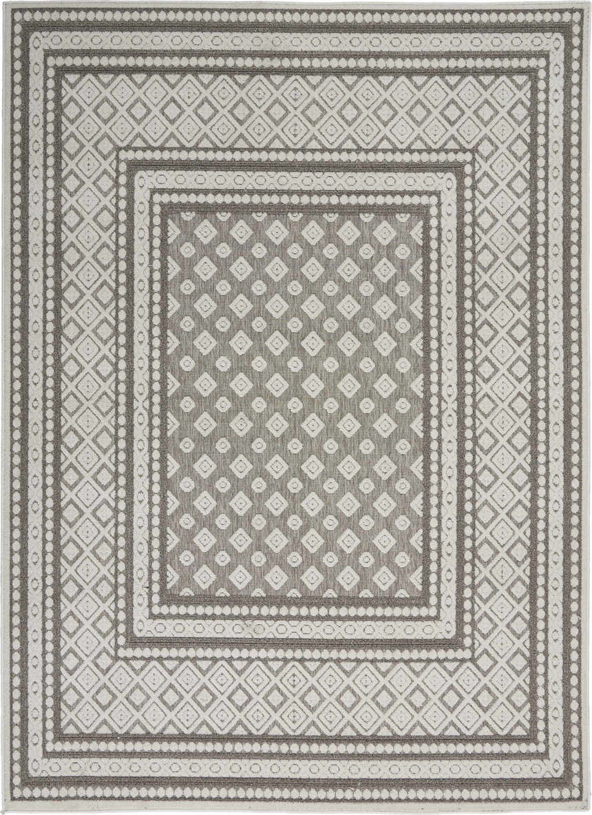 Close-up of the Nourison Key Largo Light Grey Transitional Area Rug, featuring a geometric diamond pattern and farmhouse style.