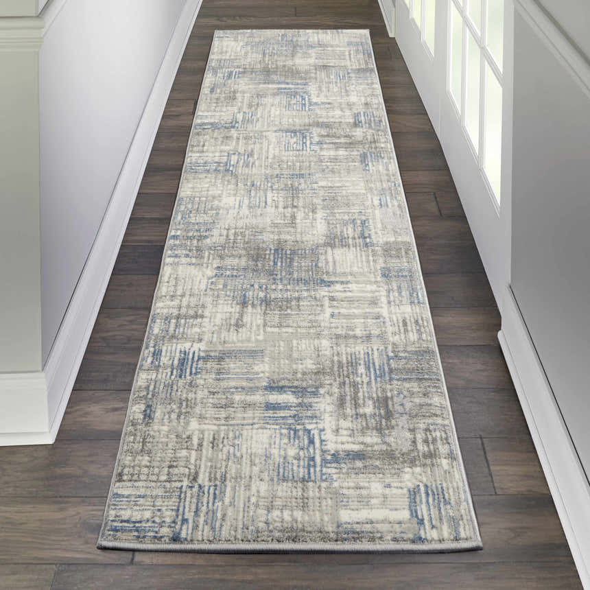 Hallway with Nourison Solace Ivory Grey Blue runner rug on dark wood floor. Modern abstract design.
