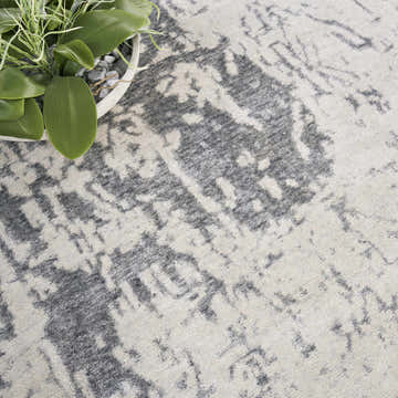 Close-up of the Sterling Nourison Silk Shadows rug. Vintage design in sterling, handmade rug texture.