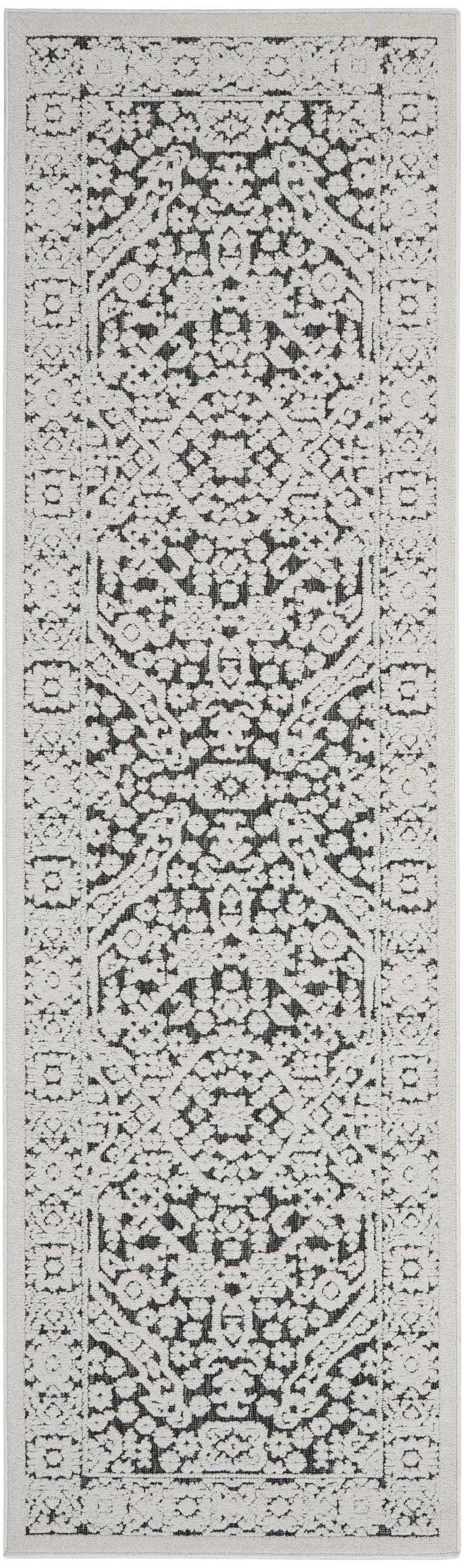 Close-up of the Nourison Key Largo Dark Grey runner rug, featuring a transitional floral pattern in medium gray tones.