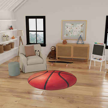 Kids room with a round Nourison Imagination Orange Rug, basketball design, chair, and toys.