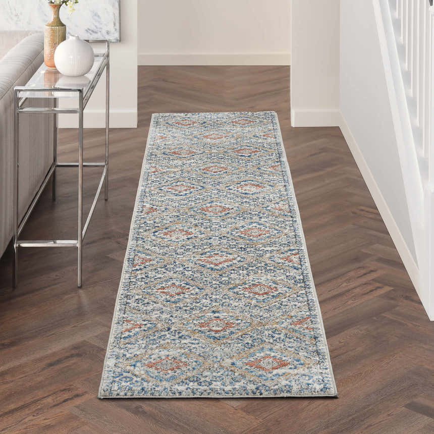 Hallway with Nourison Quarry Blue Ivory Southwestern rug runner on wood floor.