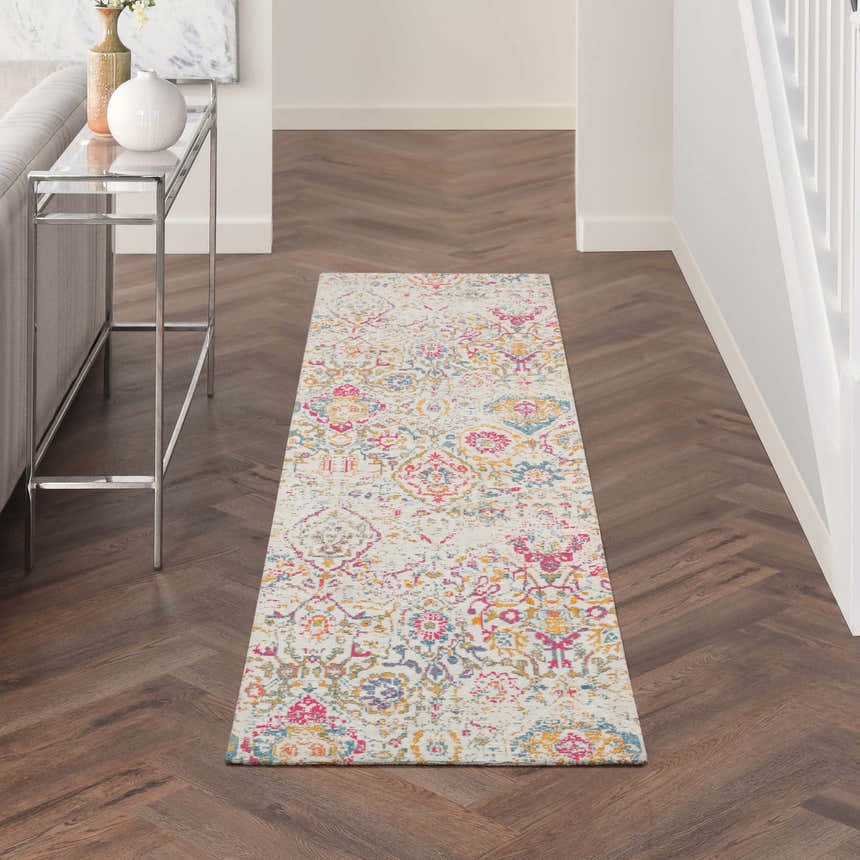 Hallway with Nourison Damask Multicolor Bohemian runner rug, wood floors, console table, and bright, airy feel.