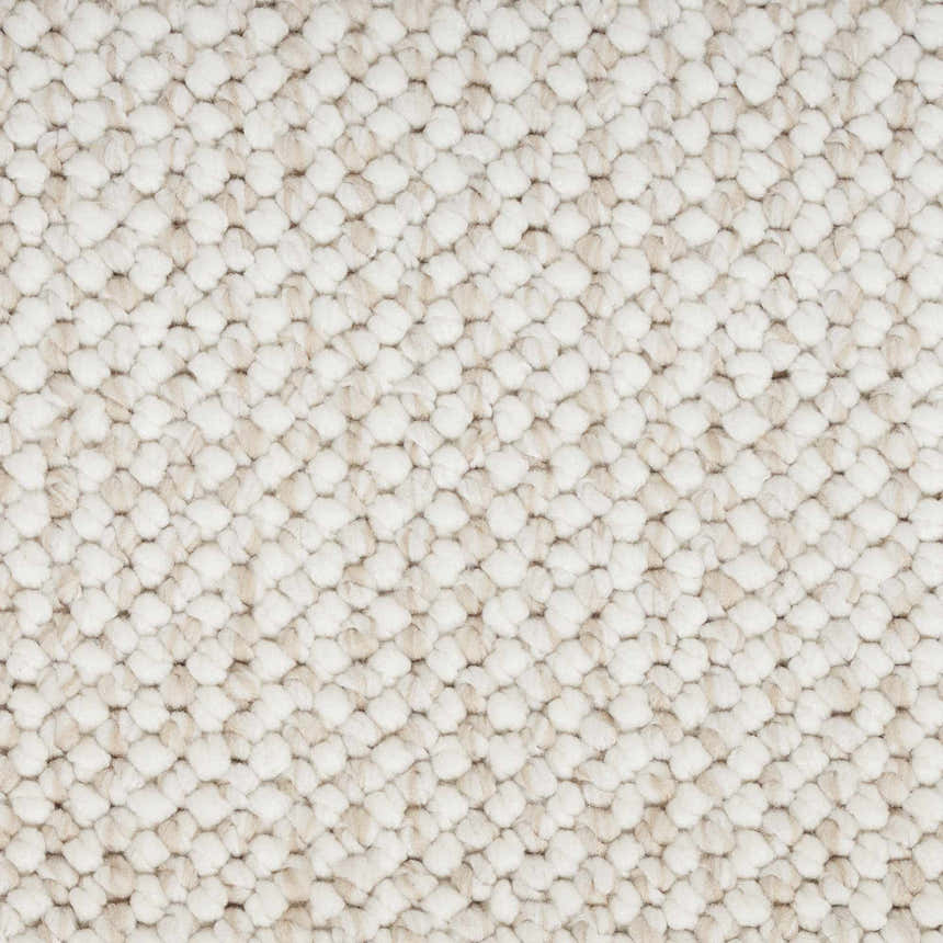 Close-up of the textured Nourison Natural Texture Ivory Beige Farmhouse Area Rug, showing its chunky, looped design.