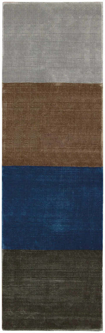 Close-up of the Calvin Klein Home Lunar Pewter, Foal, Klein Blue, Storm rug. Features horizontal color blocks.