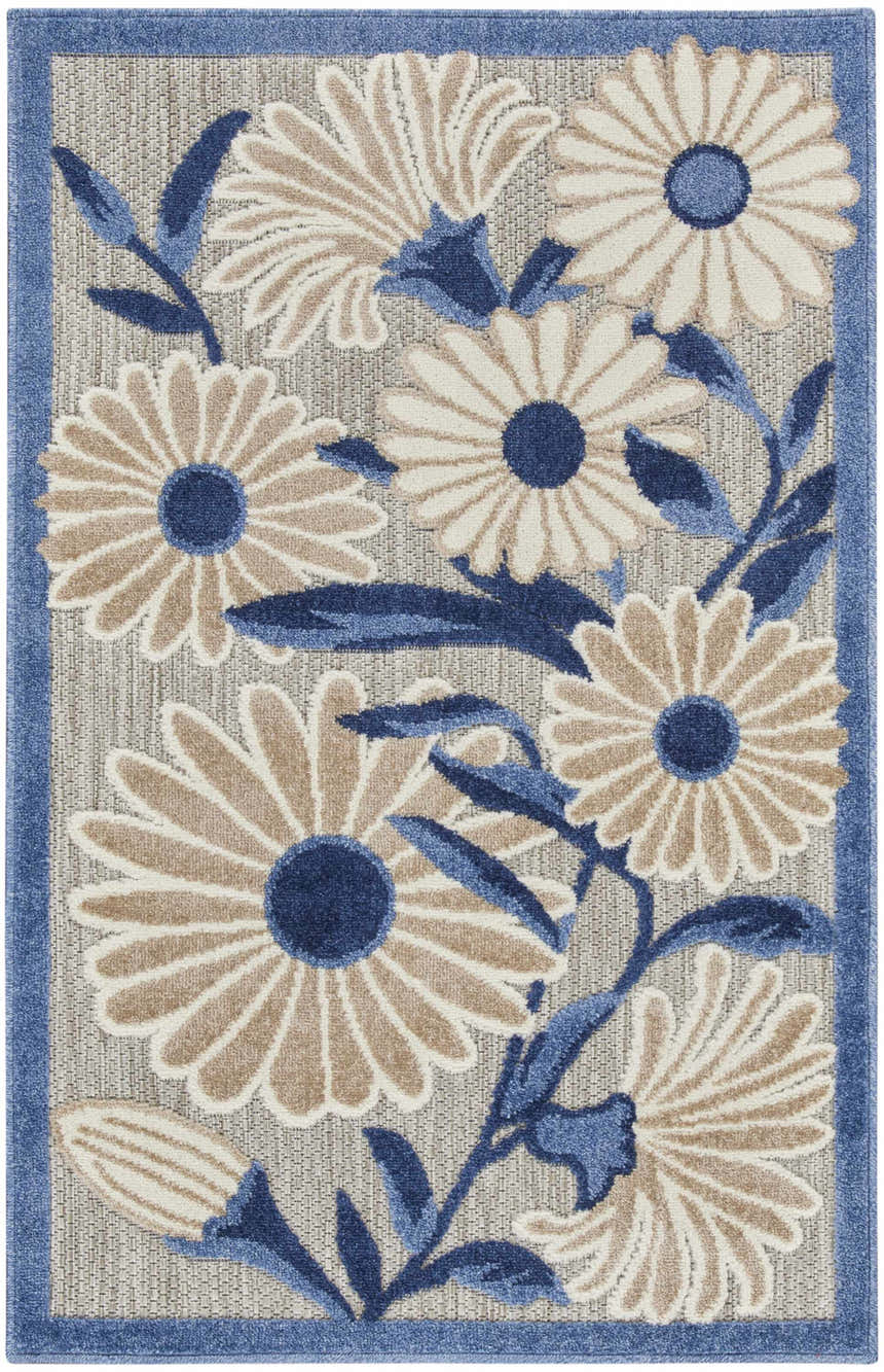 Close-up of the Nourison Aloha Blue Grey Outdoor Area Rug featuring a floral pattern with blue leaves and a blue border.