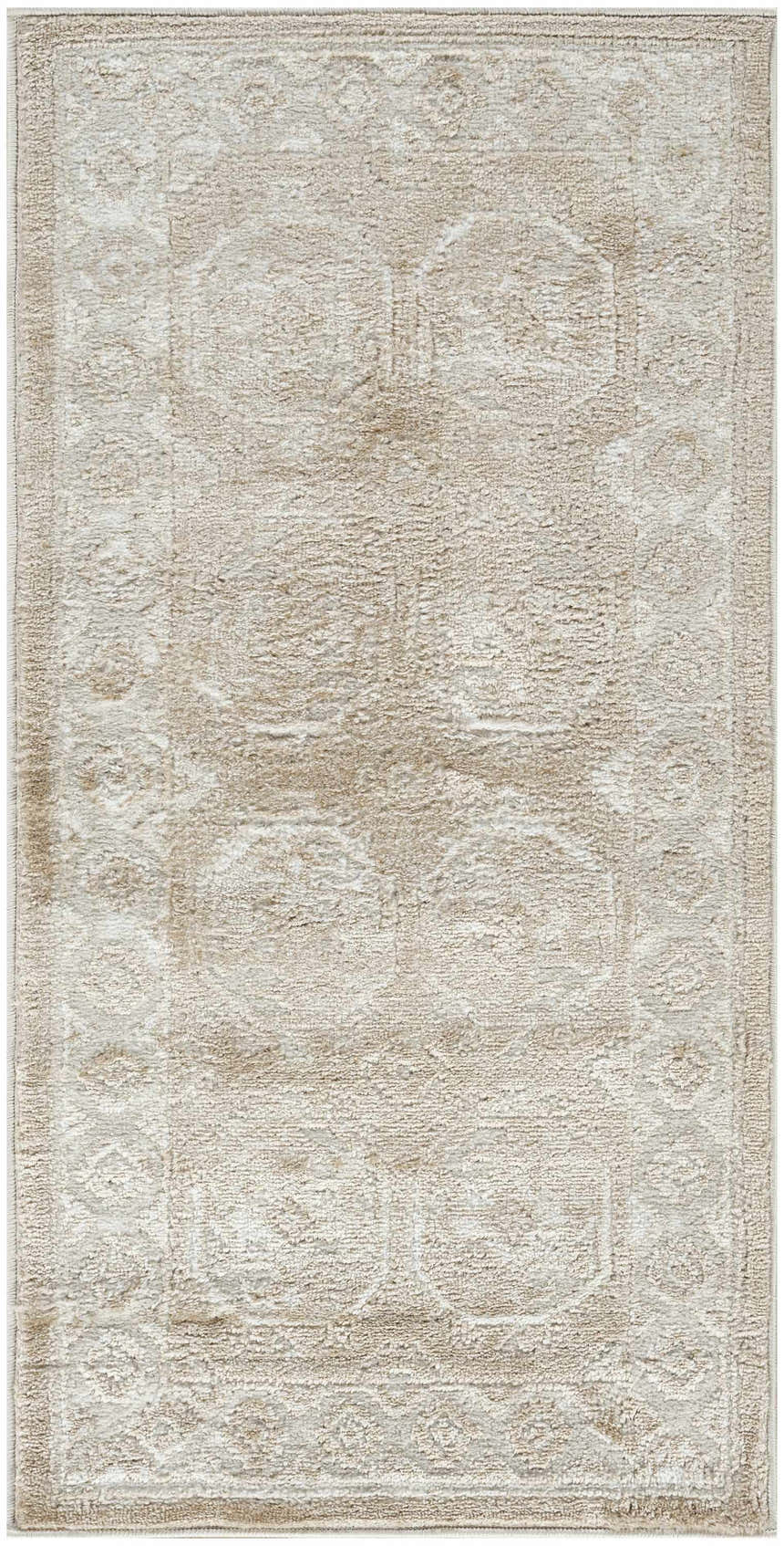 Close-up of the Nourison Dekor Cream Beige vintage rug, showcasing its high pile texture and subtle, elegant pattern.