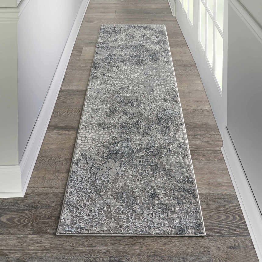 Hallway with grey wood floors and Michael Amini MA90 Uptown Grey runner rug. Modern, neutral tones.