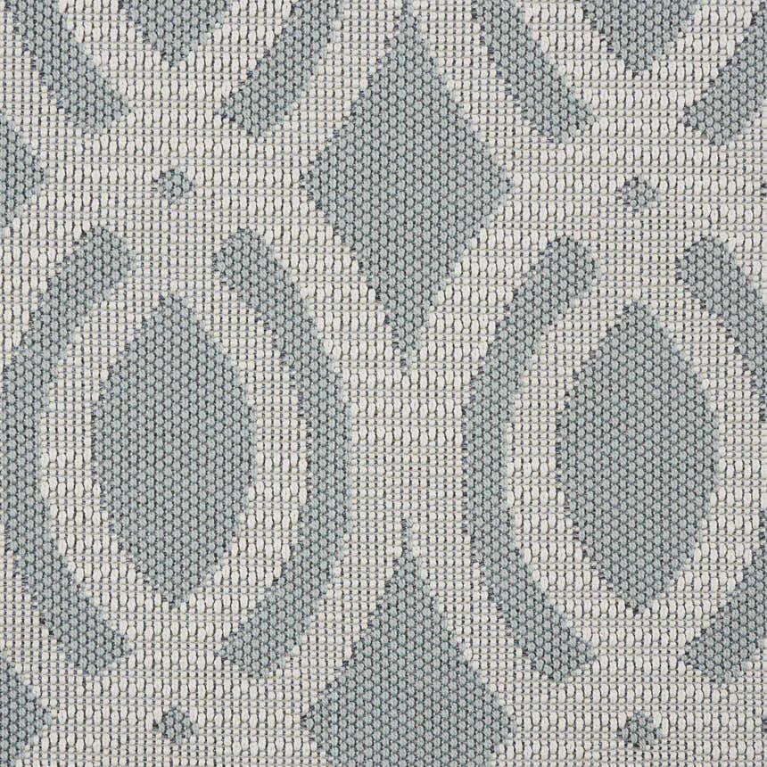 Close-up of the Nourison Aruba Light Blue Cream Beach Area Rug, showing the textured weave and geometric pattern.