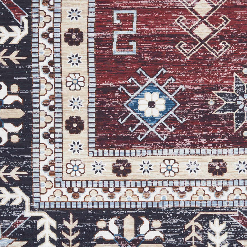 Close-up of Nourison Fulton Red Vintage Area Rug. Features a detailed geometric and floral pattern in red, black, and beige.