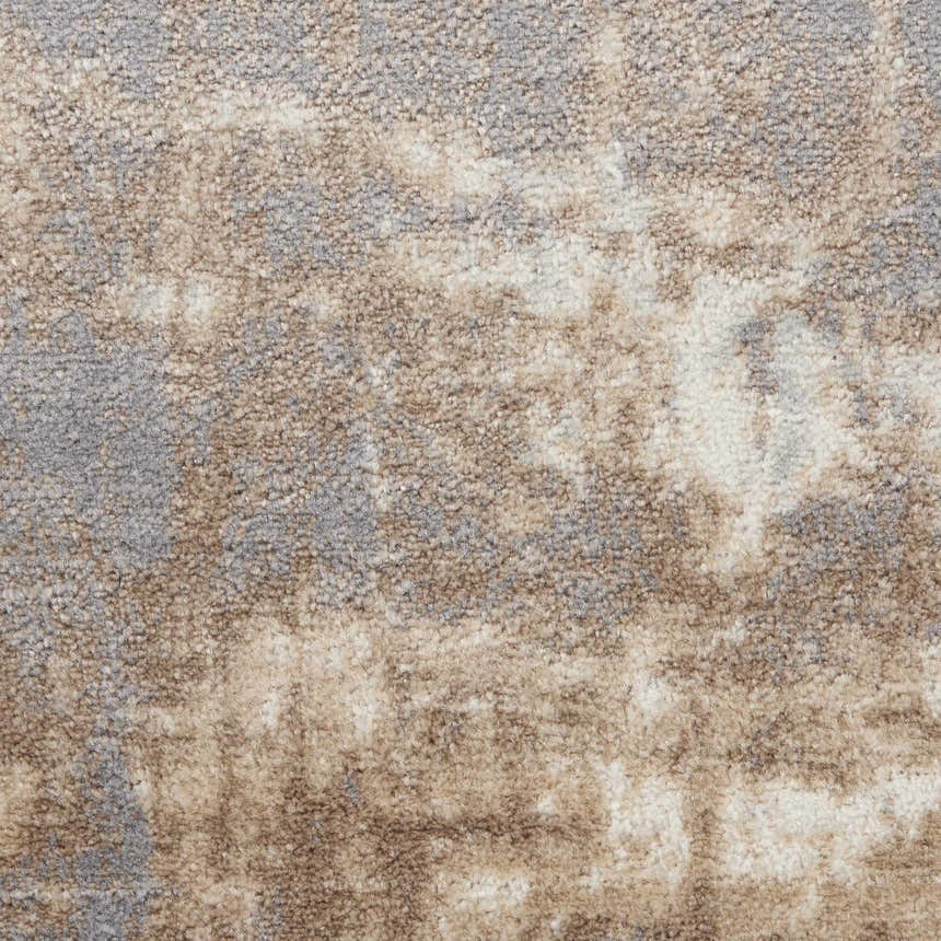 Close-up of the high-pile Nourison Elation Grey Ivory rug. Abstract pattern with chestnut, ivory, and grey tones. Soft texture.