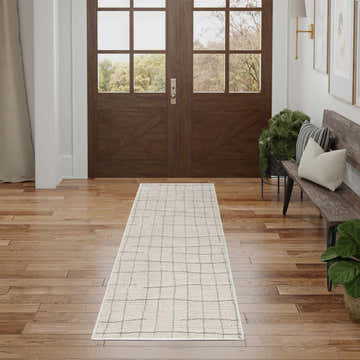 Entryway with wood floors and Nourison Andes Ivory Grey Scandinavian runner rug leading to double doors.