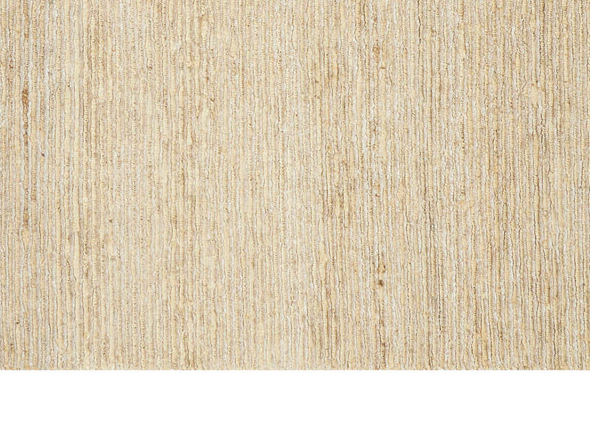 Close-up of the textured, neutral-toned Calvin Klein Mesa Gypsum rug. Handmade rayon and cotton fibers.