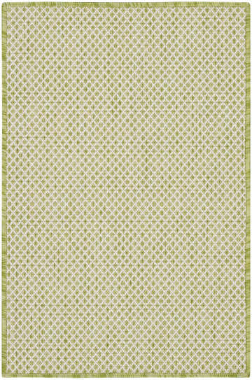 Close-up of the Nourison Courtyard Ivory Green rug, featuring a diamond pattern and a green border.