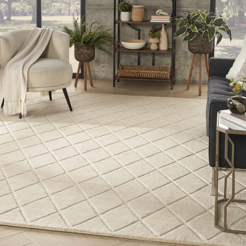 Living room scene with the Nourison Wool Haven Ivory rug, neutral furniture, and a mid-century modern vibe.