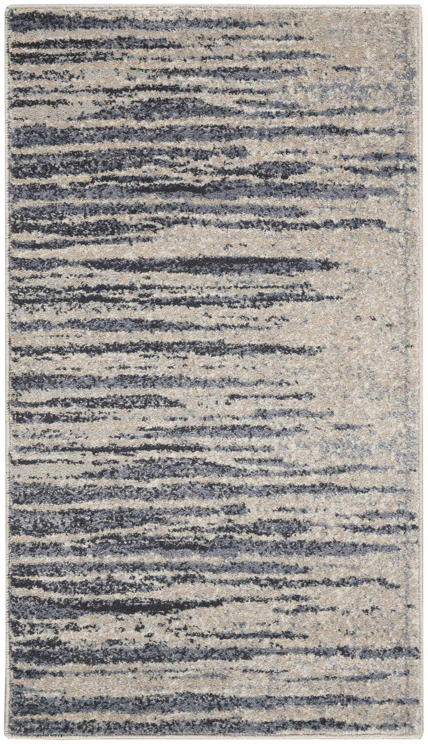 Close-up of Nourison Moroccan Celebration Blue Beige rug featuring a modern, abstract stripe pattern and soft texture.