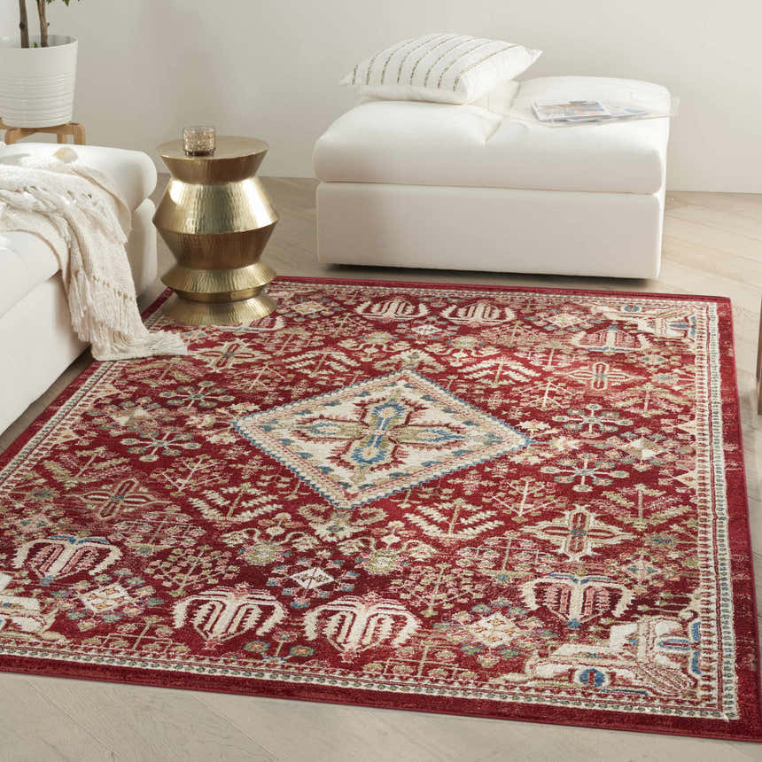 Living room scene with a Nourison Karisma Brick Ivory rug, white sofa, gold side table, and light wood floors.