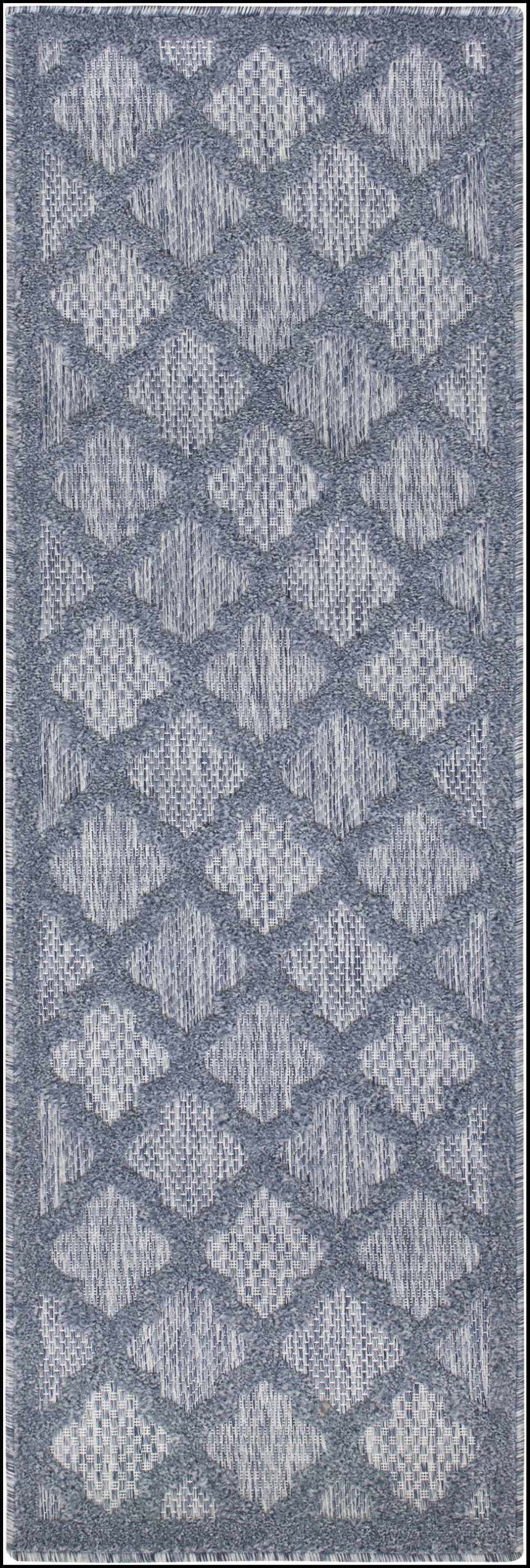 Close-up of Nourison Easy Care Denim Blue rug featuring a diamond trellis pattern.