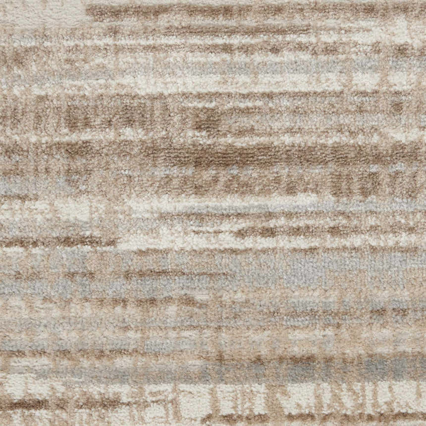 Close-up of the high-pile Nourison Elation Ivory Grey rug, showing the chestnut, ivory, and grey striated pattern.