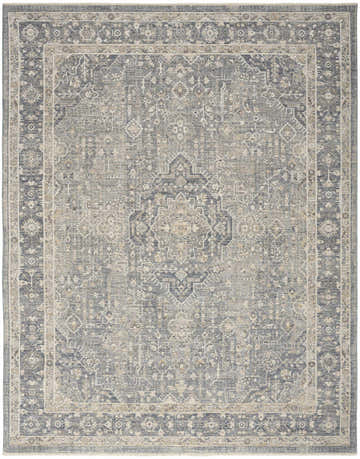 Close-up of the Nourison Retreat Blue Vintage Area Rug, featuring a traditional, light blue and beige pattern.