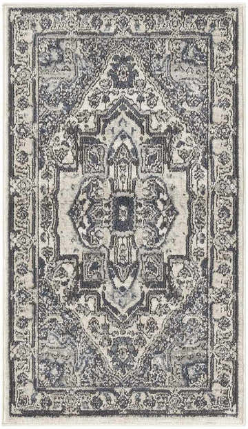 Close-up of the Nourison Quarry Ivory Navy vintage rug, featuring a classic central medallion and floral border pattern.