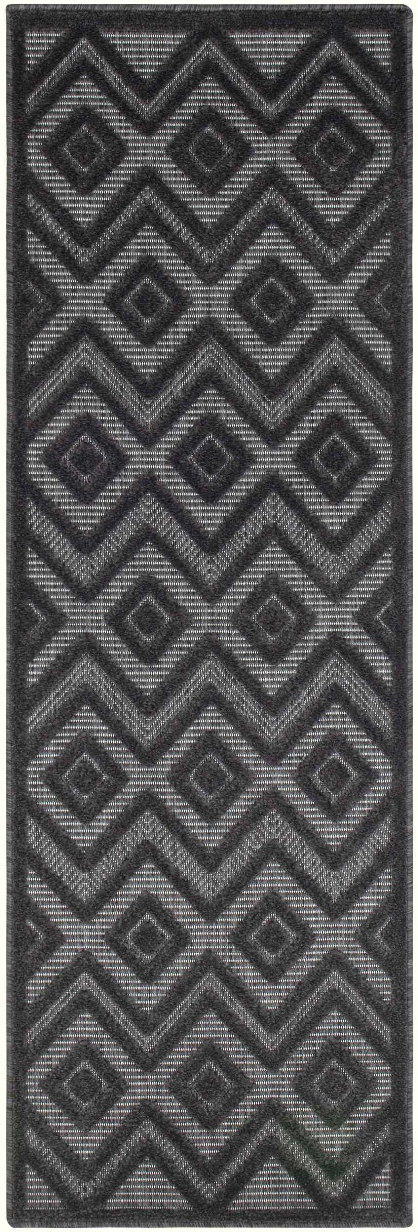 Close-up of the Nourison Versatile Charcoal Black rug. Modern diamond pattern in shades of taupe and black.