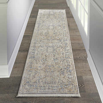 Hallway scene with Nourison Lustrous Weave Ivory Blue Vintage rug runner on dark wood floor. White trim and natural light.