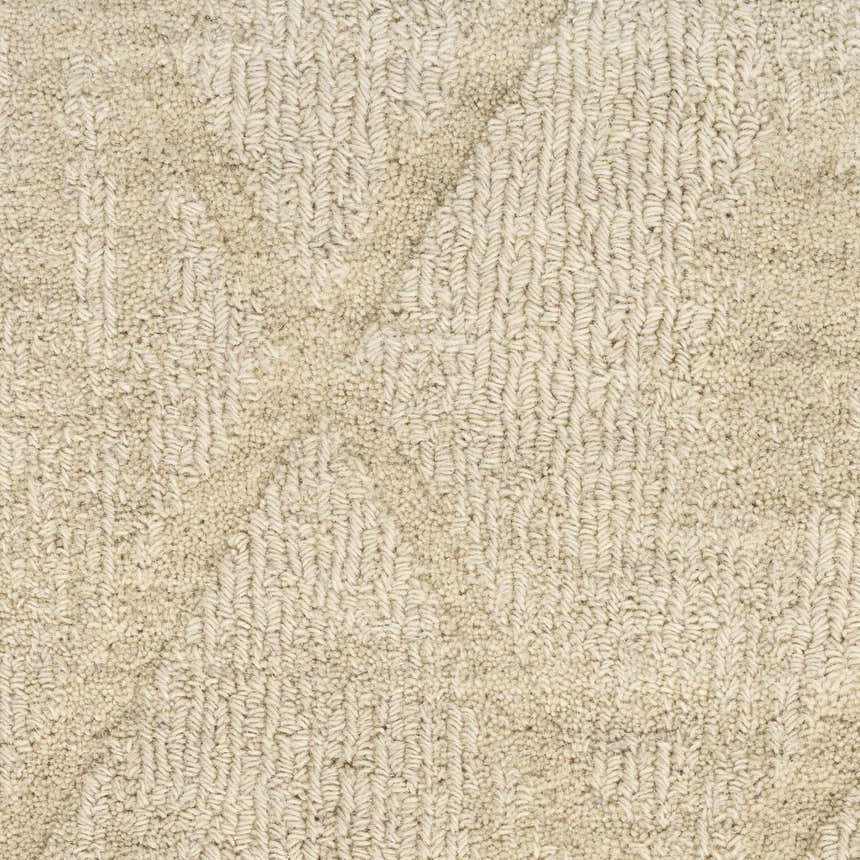 Close-up of the beige Nourison Wool Haven rug, showing its handmade texture and mid-century modern pile design.