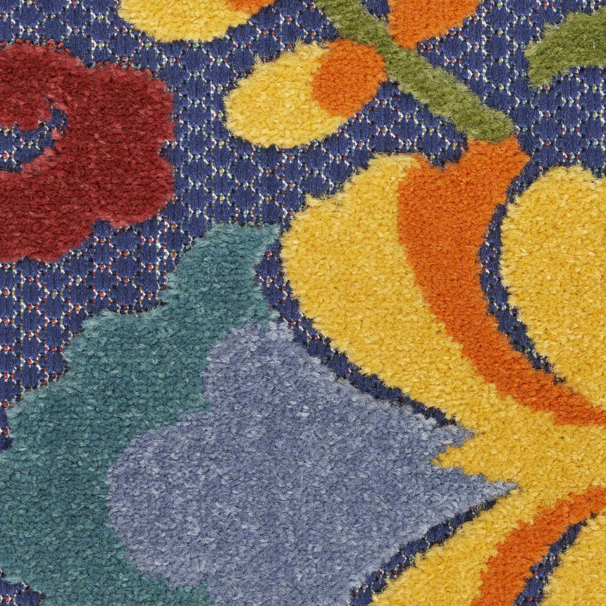 Close-up of Nourison Aloha Navy Multicolor rug showing floral pattern in red, yellow, orange, green, and blue hues.