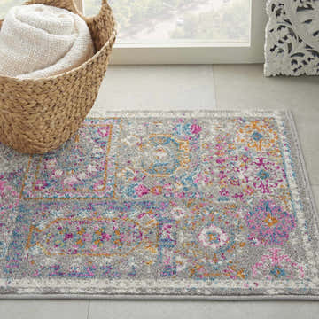 Close-up of Nourison Passion Grey Multicolor Bohemian Indoor Area Rug with pink, blue, and orange accents.