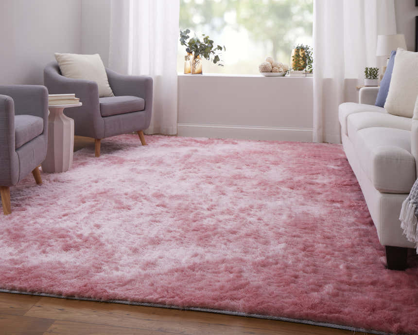 Living room scene with gray armchairs and a white sofa on a Feizy Indochine blush pink area rug. Roomscene-Rectangle