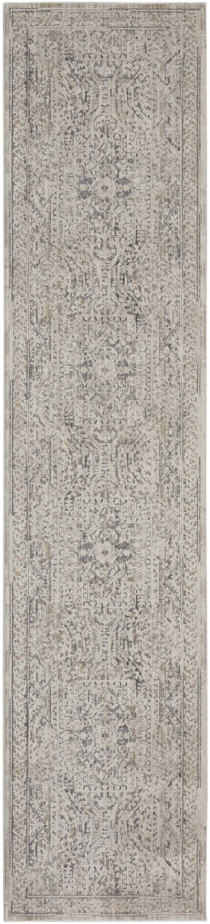 Close-up of the Nourison Lynx Ivory Grey Blue Vintage Indoor Area Rug, featuring a detailed, distressed pattern.