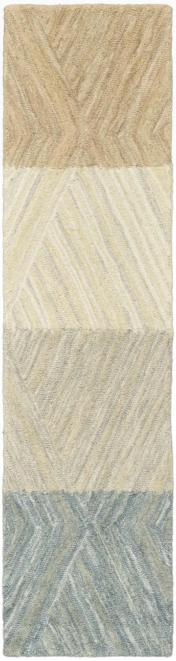 Close-up of a Nourison Graceful Blanket runner rug. Handmade wool rug with a geometric pattern in beige, cream, and blue.