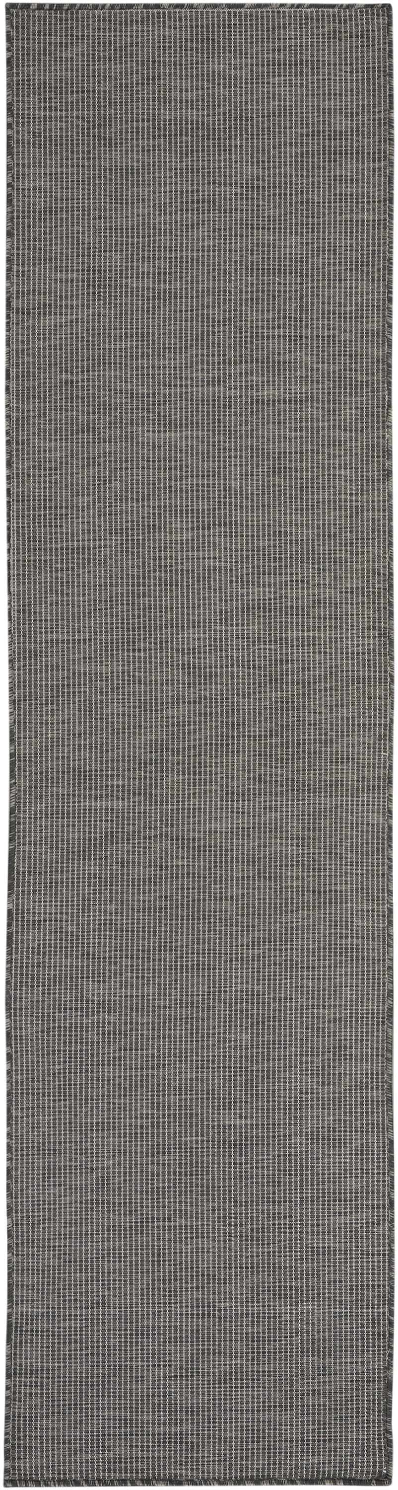 Close-up of the Nourison Positano Charcoal Modern Area Rug showing the taupe color and subtle striped pattern.