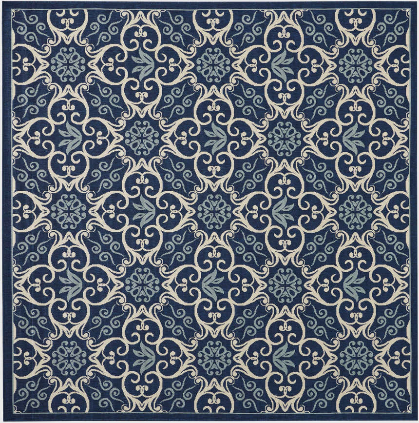 Detailed Nourison Caribbean Navy Contemporary Area Rug with a swirling floral pattern in navy, cream, and light blue.